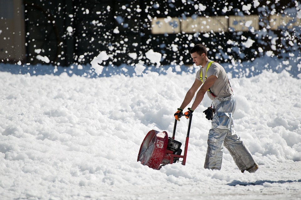 Maintenance Worker Removing Snow