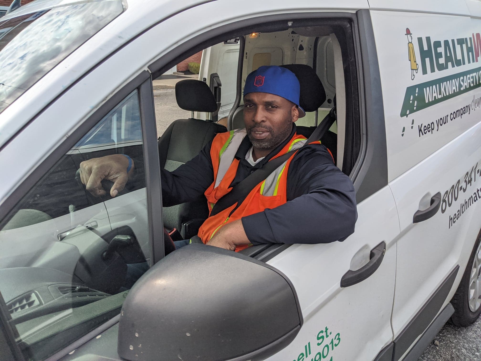Tim enjoys seeing everyone on his routes. You can always count on Tim to be on time. A picture of Tim in a Health Mats truck.
